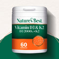 Nature's Best Vitamin D3 & K2 supplement container on a green and white background