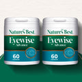 Two containers of Nature's Best Eyewise Advance capsules on a green and white background