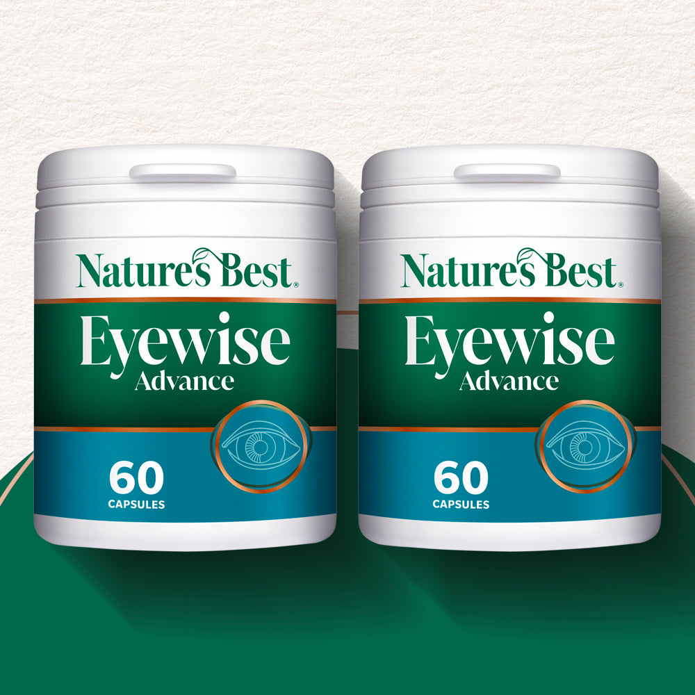 Two containers of Nature's Best Eyewise Advance capsules on a green and white background