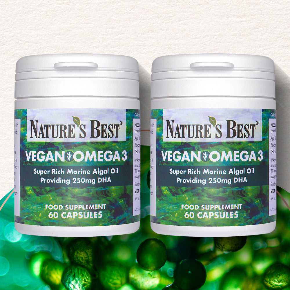 Two bottles of Nature's Best Vegan Omega 3 supplement on a green background with capsules.